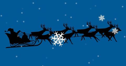 Silhouette of Santa's Sleigh with Reindeer in Snowy Sky