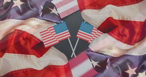 Symbolic crossed u.s. Flags with patriotic fabric background