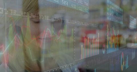 Woman Analyzing Data Charts on Digital Interactive Panels