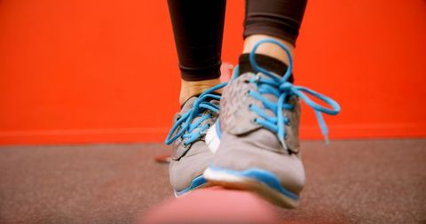 Close-up of Woman Balancing in Fitness Studio, Wearing Sport Shoes