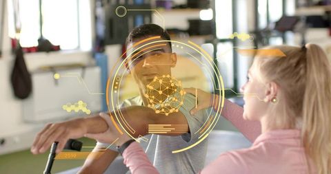 Therapist supporting patient arm rehabilitation with augmented reality HUD in rehab gym