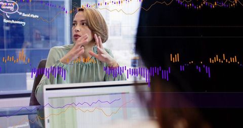 Businesswoman presenting data with overlaid charts illustrating team analytics, collaboration