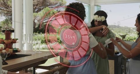 Friends embracing at garden party featuring cupcakes, champagne and futuristic ar overlay