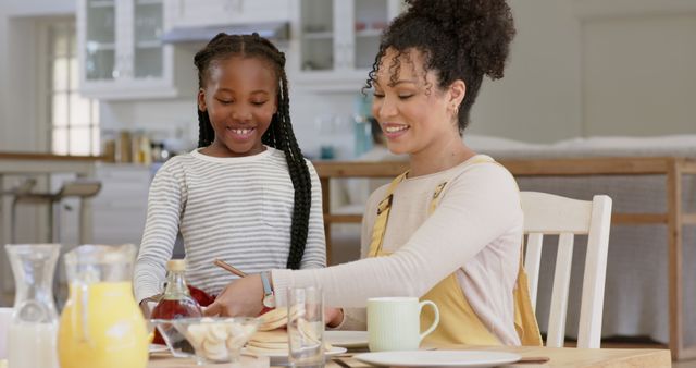 Happy Mother and Daughter Enjoying Breakfast Together - Download Free Stock Images Pikwizard.com