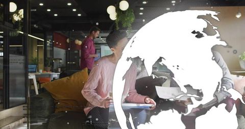 Team collaborating in modern coworking lounge with globe overlay for global business growth