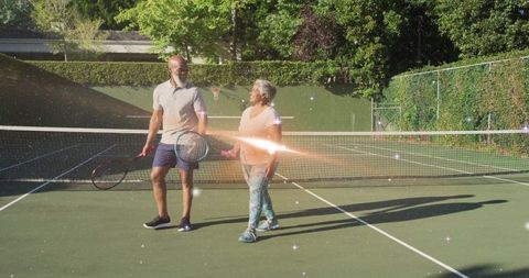 Senior Couple Enjoying Tennis Together on Serene Court