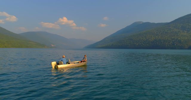 Senior Men Fishing on Tranquil Mountain Lake at Sunset - Download Free Stock Images Pikwizard.com