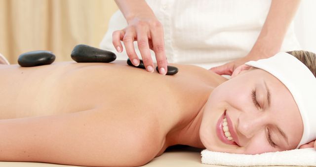 Woman Enjoying Relaxing Hot Stone Massage at Spa - Download Free Stock Images Pikwizard.com