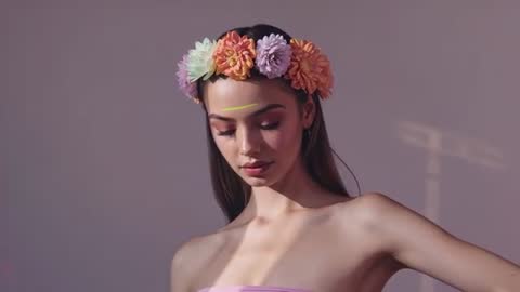 Serene Portrait with Floral Crown and Blinking Model in Shifting Sunlight
