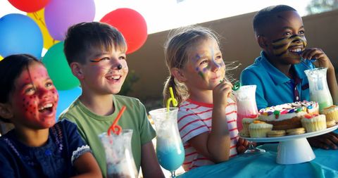 Joyful Kids Enjoying Birthday Party With Face Paint and Balloons - Download Free Stock Images Pikwizard.com