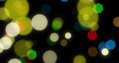 Colorful bokeh lights over black background
