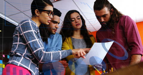 Diverse Team Analyzing Business Statistics in Office