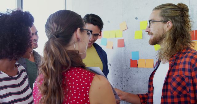 Diverse Group of Young Colleagues Brainstorming and Collaborating on Project - Download Free Stock Images Pikwizard.com