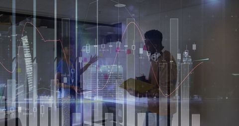 Gesturing Professionals Analyzing Financial Charts in Modern Office
