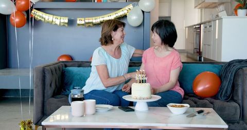 Senior Friends Celebrating a Home Birthday Party Together