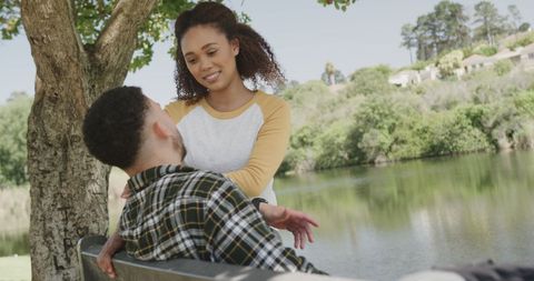 Interracial Couple Enjoying Peaceful Moment by Riverside