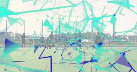 Male soccer players practicing passing on turf with turquoise geometric overlay