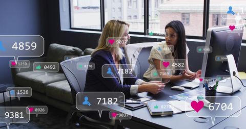 Diverse Female Professionals Analyzing Social Media Engagement