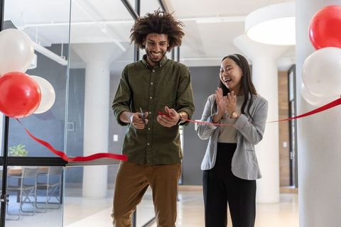 Diverse business team celebrating opening ceremony