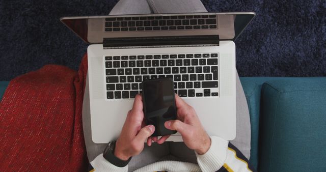 Person Using Smartphone and Laptop for Multitasking at Home - Download Free Stock Images Pikwizard.com