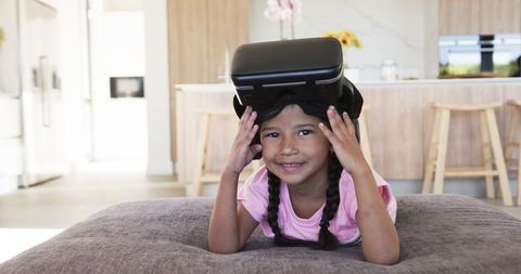 Young Girl Enjoying Virtual Reality Technology at Home