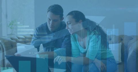 Couple Analyzing Financial Data with Statistical Overlay