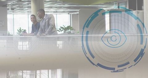 Business Professionals Discussing on Mezzanine with Digital HUD Overlay