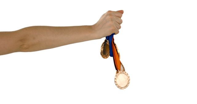 Hands Holding Multiple Gold Medals on Ribbons - Download Free Stock Images Pikwizard.com