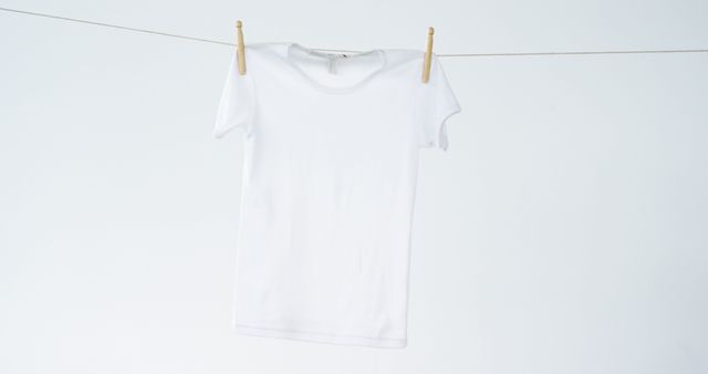 Blank White T-Shirt Hanging on Clothesline Isolated on White - Download Free Stock Images Pikwizard.com