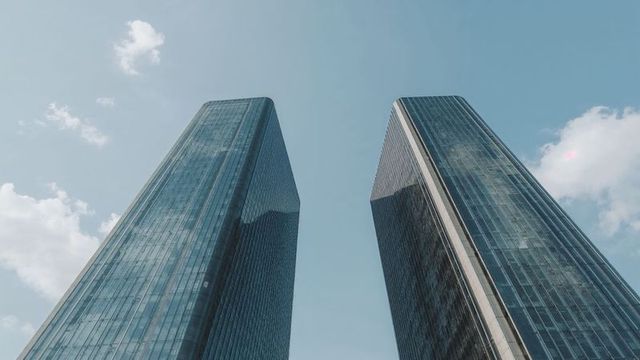 Dramatic View of Modern Twin Skyscrapers in City Skyline