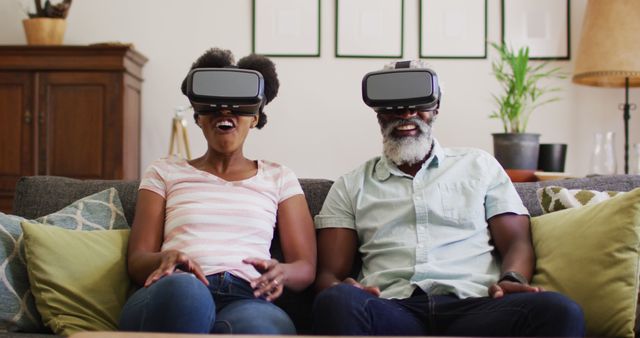 Happy Couple Enjoying Virtual Reality Experience on Sofa - Download Free Stock Images Pikwizard.com