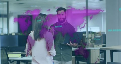 Coworkers Discussing Data Analysis With Digital Map Overlay