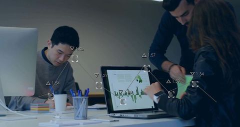 Collaborating team reviewing green analytics chart on laptop at modern office workspace