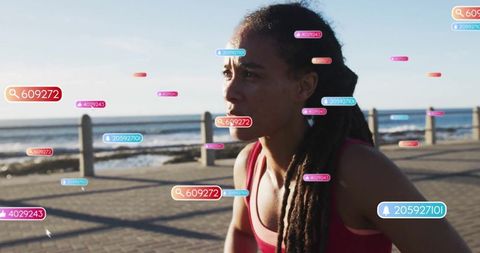 Fit Woman Jogging by Sea with Digital Health Interface Overlays