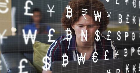 Man with curly hair working on laptop with floating currency symbols fintech concept