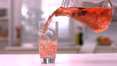 Refreshing Berry Juice Poured into Glass in Slow Motion