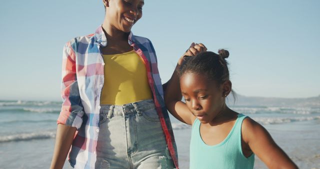 Mother and Daughter Walking on Beach Holding Hands - Download Free Stock Images Pikwizard.com