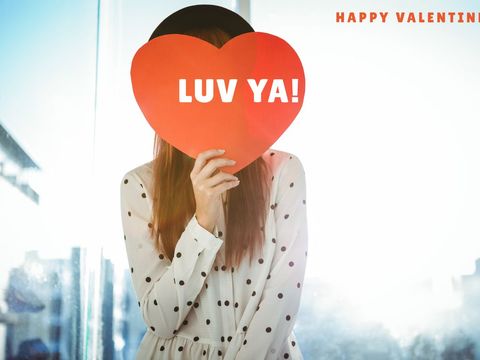 woman holding heart sign celebrating valentine's day love - Download Free Stock Templates Pikwizard.com