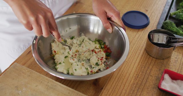 Chef Mixing Ingredients in Metal Bowl on Wooden Table - Download Free Stock Images Pikwizard.com