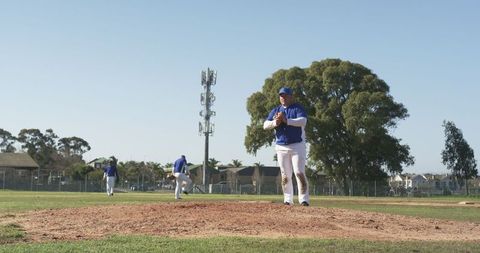 Baseball Team Prepares on Mound Under Clear Skies