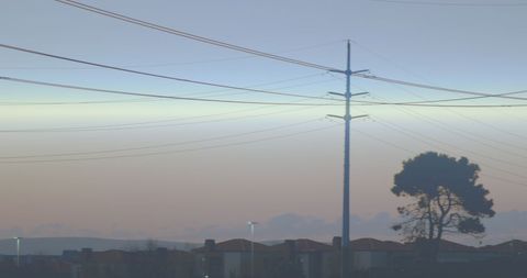 Electricity Pylons Against a Serene Sunset Sky - Download Free Stock Images Pikwizard.com