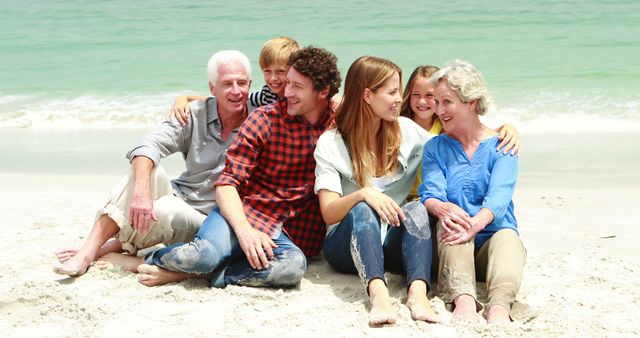 Multi-generational family relaxing on a sandy beach, enjoying a sunny day by the ocean. Perfect for illustrating concepts of family bonding, happiness, summer vacations, and togetherness. Ideal for travel brochures, family-related advertisements, and leisure activity promotions.
