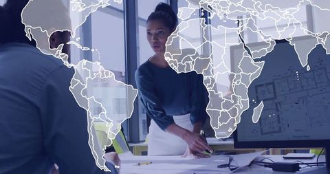 Professional Woman Leading Collaboration in Modern Office Setting