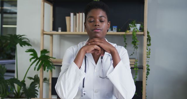 Calm Female Doctor Meditating in Office with Closed Eyes - Download Free Stock Images Pikwizard.com