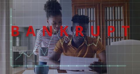 Couple reviewing bills at home with bankrupt financial graph overlay, debt crisis
