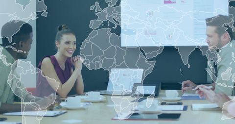 Diverse Team Discussing Strategy with Digital World Map Overlay - Download Free Stock Images Pikwizard.com