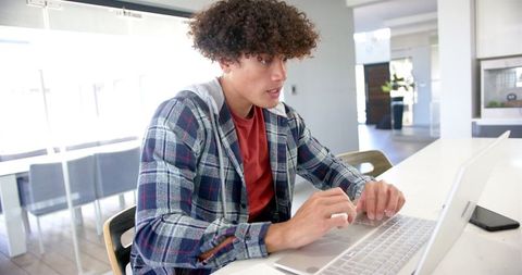 Young Professional Typing on Laptop in Cozy Home Office Setup - Download Free Stock Images Pikwizard.com