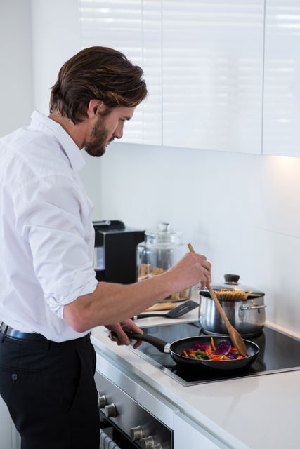 Man preparing a food in kitchen at home