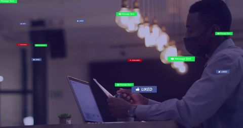 Tech-savvy Businessman Engaging with Social Media on Laptop