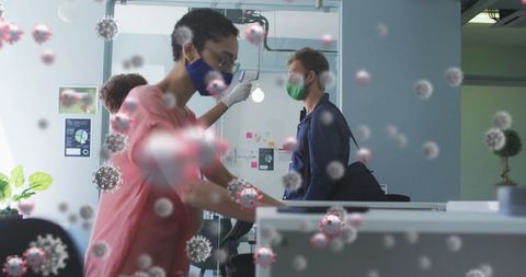 People in office with covid-19 virus particles and face masks